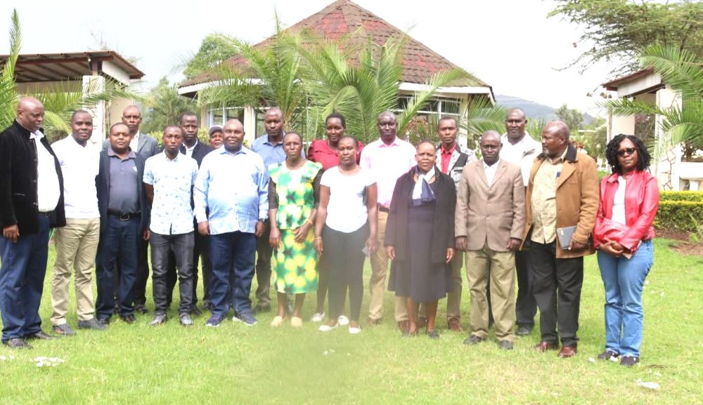Prof. John Mosonik Chancellor of Rongo University with teachers and Board of Management members from Uswet and Kimawit schools during a sponsored retreat in Bomet County refined