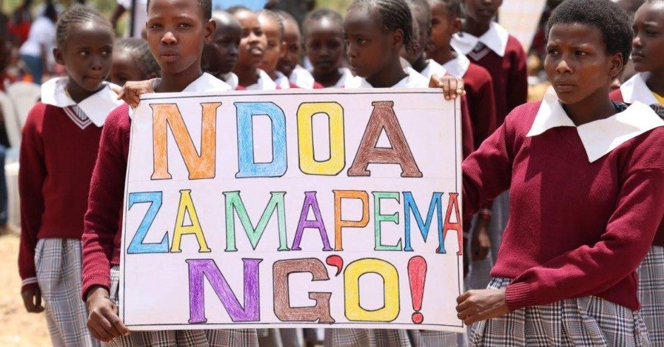 Learners carry an anti-early marriage banner