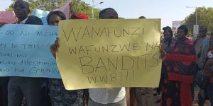 Isiolo teachers holding placards during demonstration