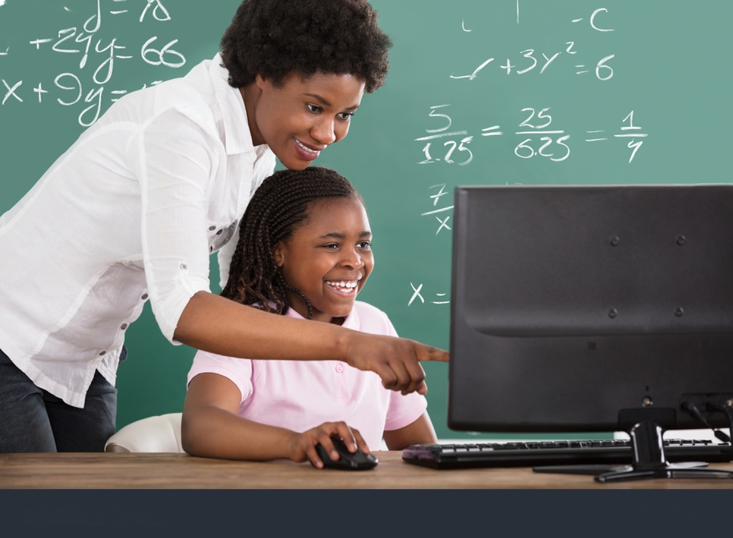 A teacher teaching with a computer