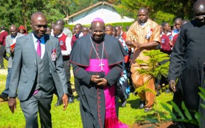 From left:.Patrick Naitiri Boys Chief Principal Samuel Barasa with Bishop Mark Kadima at Naitiri Boys'  School compound 
