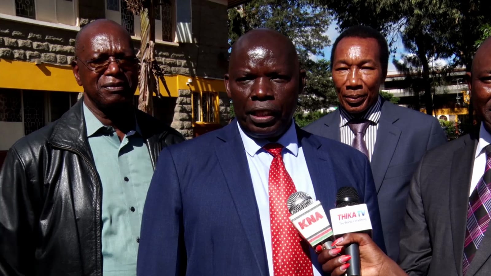 Thika High School Chief Principal Julius Muraya addressing the press in the school