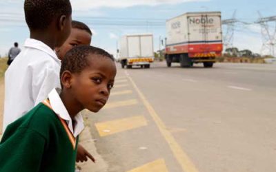 Learners waiting to cross the road. The New NTSA traffic rules on instant fine will boost their safety and minimize accidents.