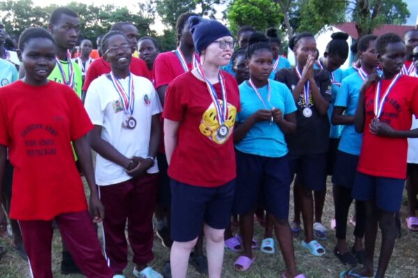  Visually impaired students from Thika School for the Blind proudly display their gold, silver, and bronze medals.