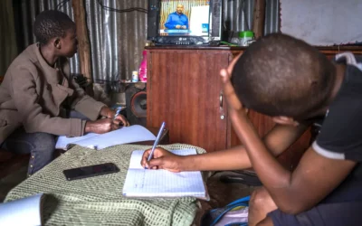 Learners doing their home assignments in a single room