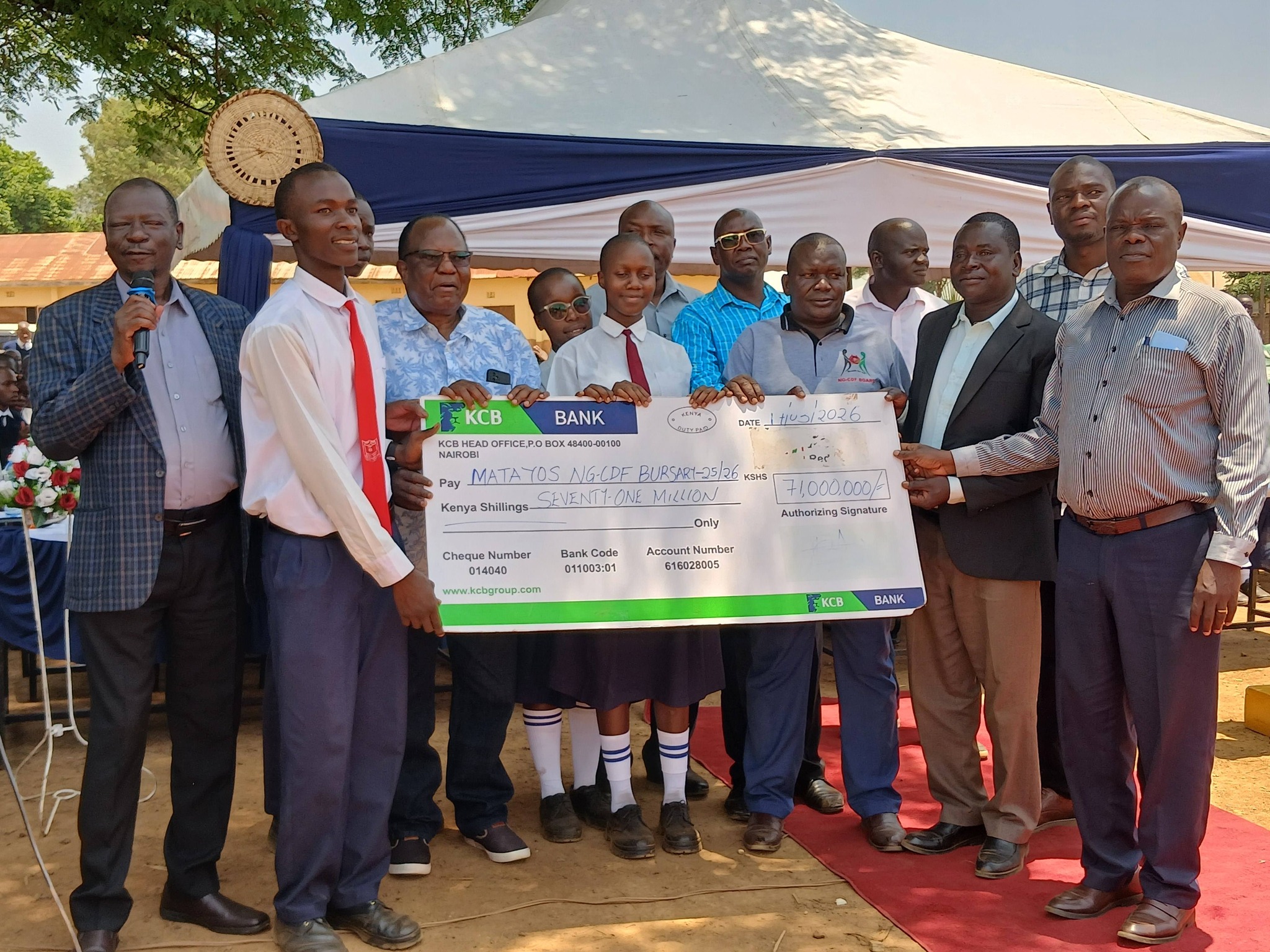 Matayos MP Geoffrey Odanga (with mic) during the bursary distribution