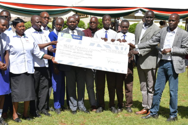 Far right: Baringo Central MP Joshua Kandie with NGCDF officials during the cheque release