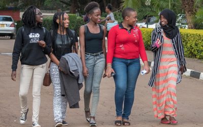 Campus students having a chat. The writer is calling upon parents to fund their daughters in Universities rather than leaving them for the World.