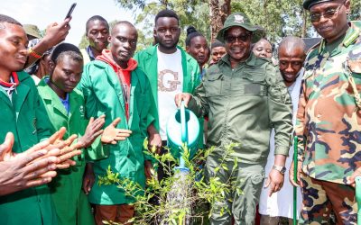 Education CS Julius Ogamba (Centre) during the tree planting drive