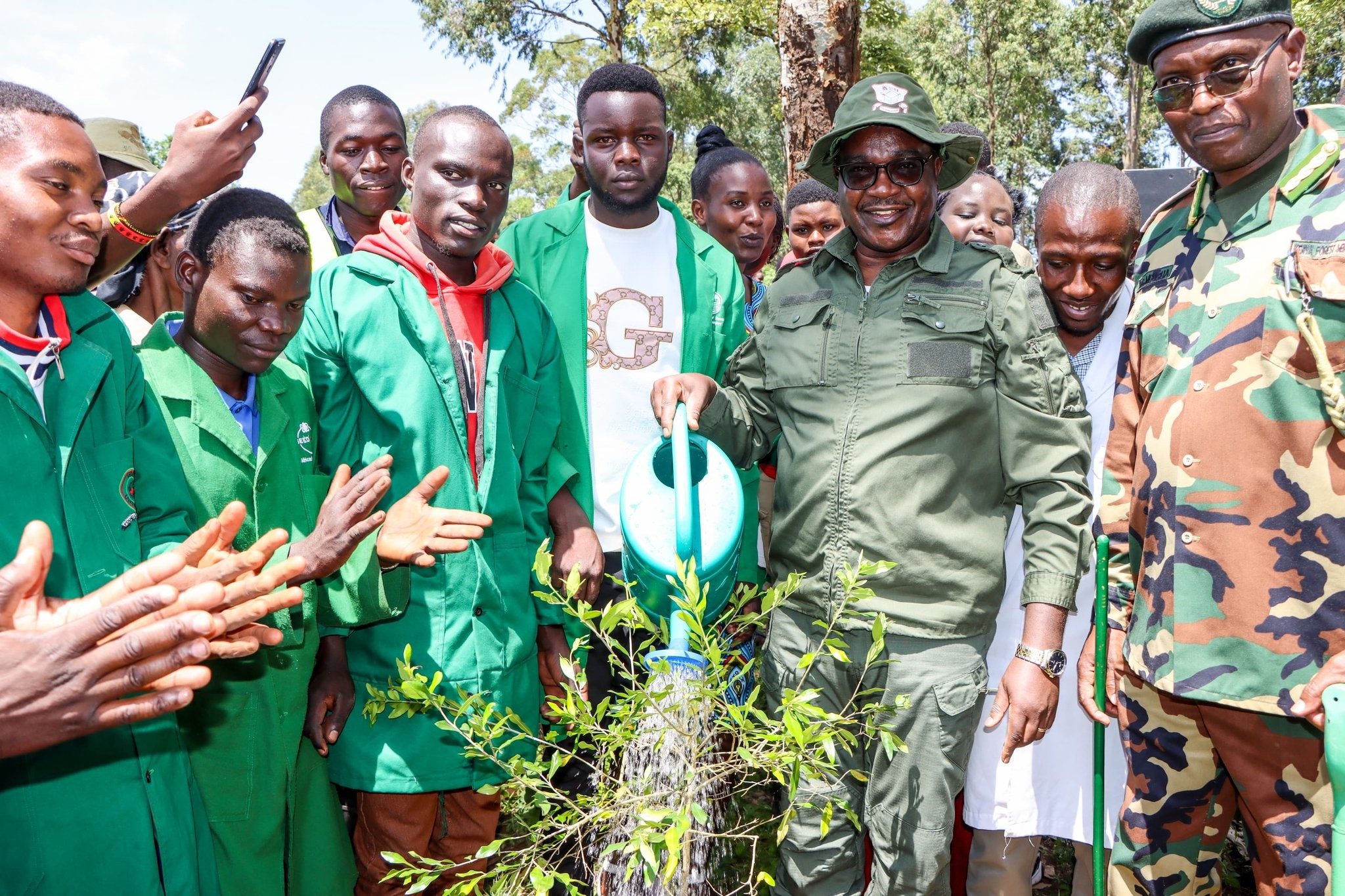 Education CS Julius Ogamba (Centre) during the tree planting drive