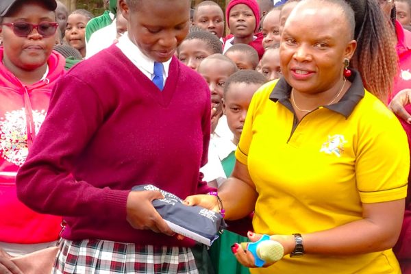Trans Nzoia County CECM in charge of education Janerose Mutama during sanitary pads distribution.