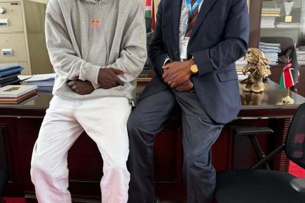 Daystar University Vice Chancellor Prof Laban Ayiro meets student-athlete Patrick Odongo at his office at Daystar University on Friday to discuss his academic and rugby progress.