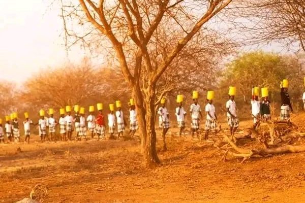 AGC Kangoletiang Girls Secondary School students on their way from fetching water