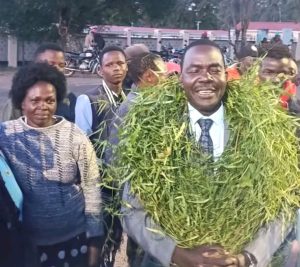 John Akola being officially received at Ol’lessos National Polytechnic upon reporting to his new duty station.