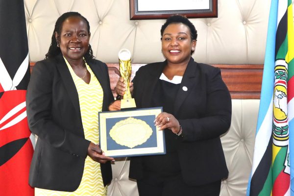 PS TVET Dr. Esther Thaara Muoria ( l) receives the AC Transformational Leadership Award from Dr. Edinah Kangwana CEO of Arise Circle Africa