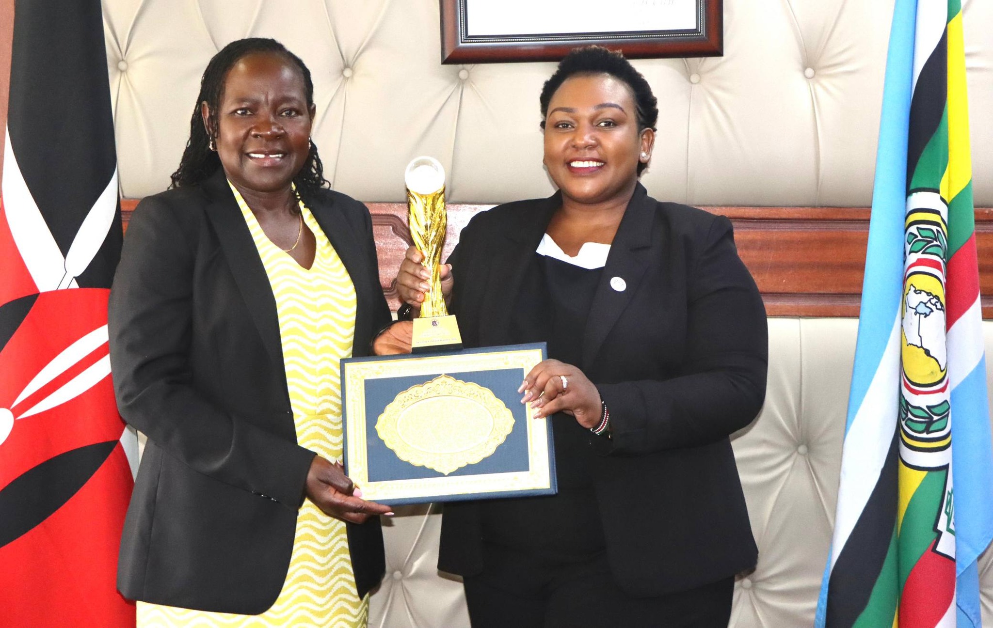 PS TVET Dr. Esther Thaara Muoria ( l) receives the AC Transformational Leadership Award from Dr. Edinah Kangwana CEO of Arise Circle Africa