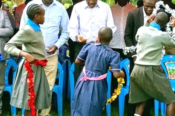 Basic Education Principal Secretary Julius Bitok inspecting condemned classrooms at Mayuge Primary School in Malava Constituency during an education development tour.