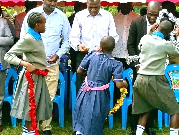 Basic Education Principal Secretary Julius Bitok inspecting condemned classrooms at Mayuge Primary School in Malava Constituency during an education development tour.