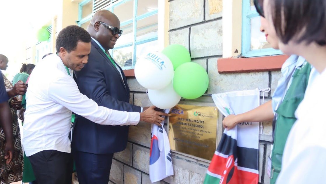 Kisumu County Chief Officer for Education Bovince Ochieng in white shirt with the official during the commissioning of special unit classroom at Ogwedhi PAG Primary School in Nyando
