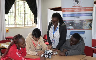 Students and an instructor with a robot during CEMASTEA 6th STEM Boot Camp