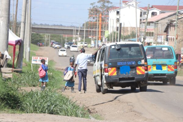 Students from Arap Moi Primary school in Kajiado North board a matatu .