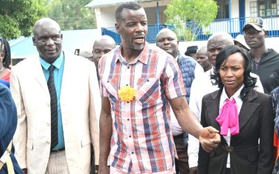 Webuye West MP Dan Wanyama with Webuye S.A Comprehensive School headteacher Hillary Kachibo at the unveiling of a new tuition storey block.