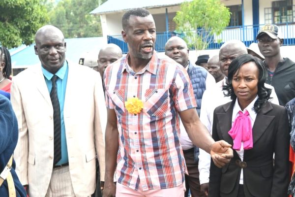 Webuye West MP Dan Wanyama with Webuye S.A Comprehensive School headteacher Hillary Kachibo at the unveiling of a new tuition storey block.
