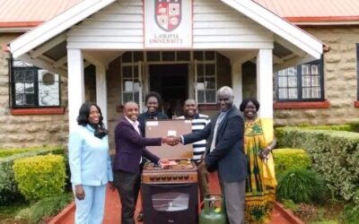 Laikipia University VC Prof. Joseph Rotich receiving a cooker donated by the alumni association. The University has officially announced a phased reopening starting this Sunday, with second- and fourth-year students set to return to campus first.