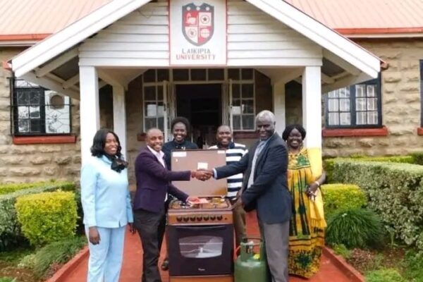 Laikipia University VC Prof. Joseph Rotich receiving a cooker donated by the alumni association. The University has officially announced a phased reopening starting this Sunday, with second- and fourth-year students set to return to campus first.