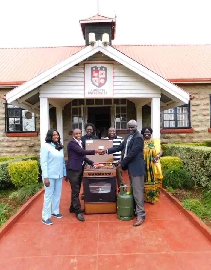 Laikipia University VC Prof. Joseph Rotich receiving a cooker donated by the alumni association. The University has officially announced a phased reopening starting this Sunday, with second- and fourth-year students set to return to campus first.