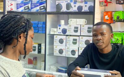 Silvester Ooko, a student entrepreneur, offers electronic repair services during his free time at Skylink Electronics.