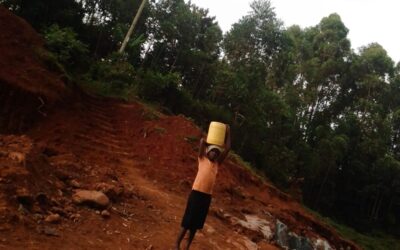 A girl fetching water from the Quarry pit at Magenche