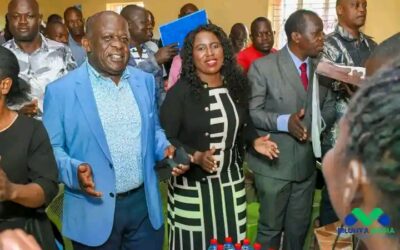 Principal secretary State department of higher education Dr Beatrice Inyangala middle with her husband Ronald Inyangala left and MMUST vice chancellor Professor Solomon Shibairo attending Easter Sunday thanksgiving mass at ACK St.Barnabas Eshikhoni church in Navakholo, Kakamega.