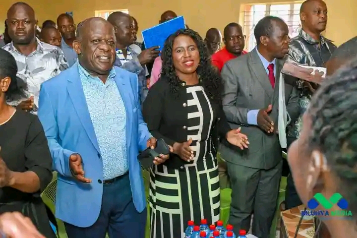 Principal secretary State department of higher education Dr Beatrice Inyangala middle with her husband Ronald Inyangala left and MMUST vice chancellor Professor Solomon Shibairo attending Easter Sunday thanksgiving mass at ACK St.Barnabas Eshikhoni church in Navakholo, Kakamega.