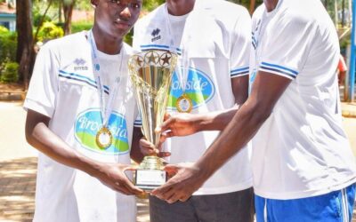Musingu Boys High School students celebrate as they hold up the handball trophy during a joyful homecoming after their 30–19 KSSSA final win over St Joseph Boys High School Kitale.