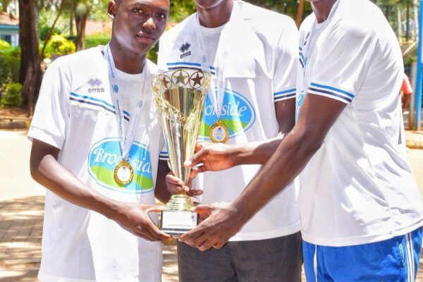 Musingu Boys High School students celebrate as they hold up the handball trophy during a joyful homecoming after their 30–19 KSSSA final win over St Joseph Boys High School Kitale.
