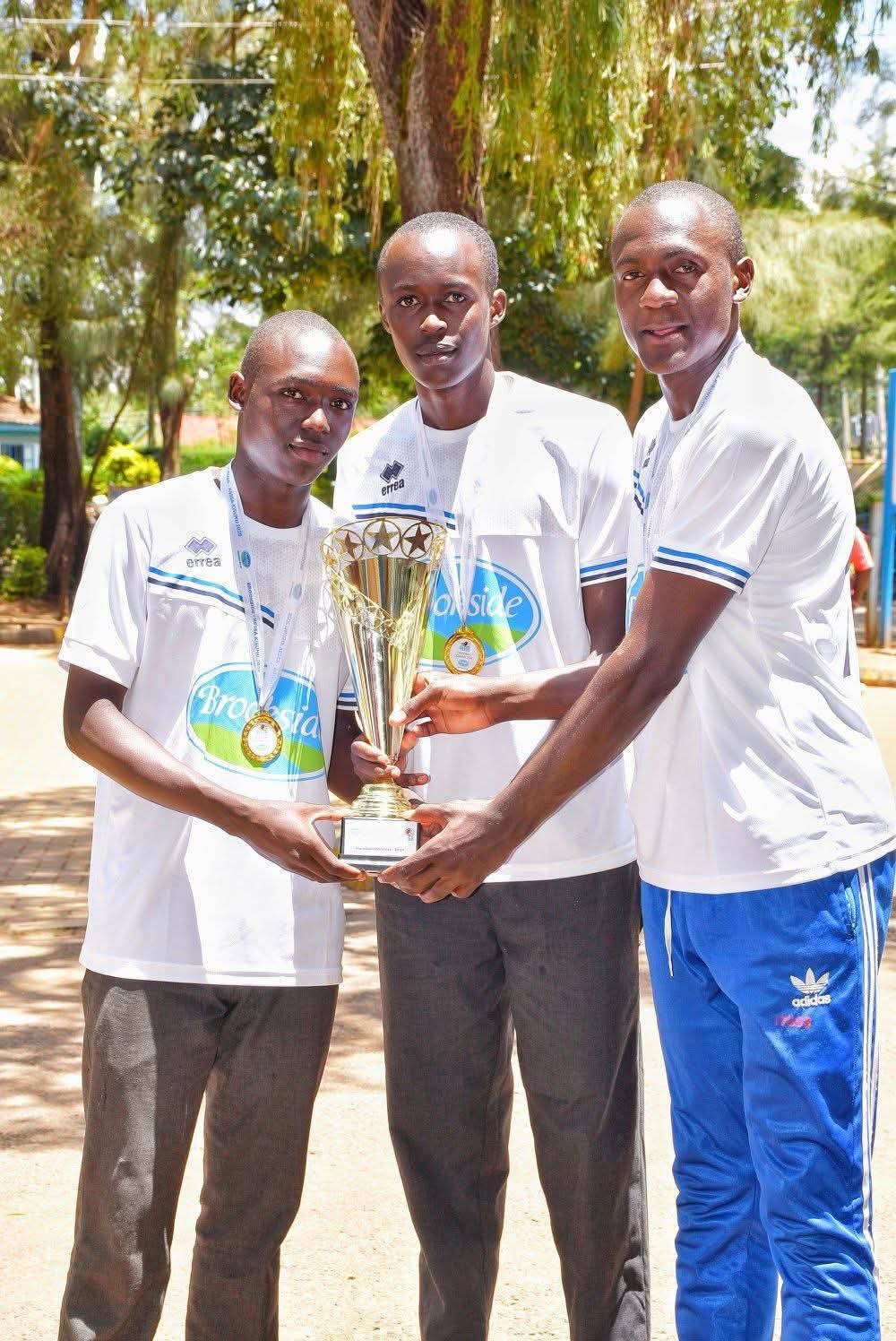 Musingu Boys High School students celebrate as they hold up the handball trophy during a joyful homecoming after their 30–19 KSSSA final win over St Joseph Boys High School Kitale.