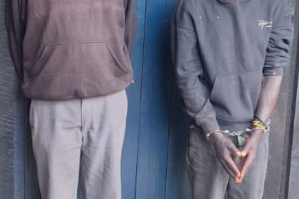 Suspects James Ngigi Ngendo (right) and James Mburi Chichu (left)after their arrest in connection with the abduction and murder of a nine-year-old boy in Githunguri.