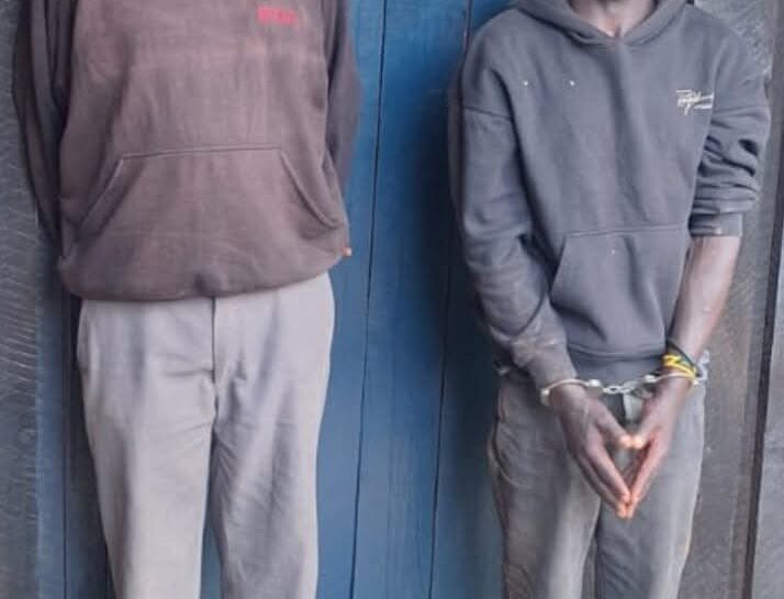 Suspects James Ngigi Ngendo (right) and James Mburi Chichu (left)after their arrest in connection with the abduction and murder of a nine-year-old boy in Githunguri.