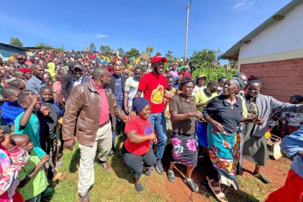 Kitutu Masaba MP Clive Gisairo(Centre in red) with Parents staff and pupils of Kenyerere Primary School during the commissioning of new modern Classrooms built by NG-CDF. Photo/Enock Okong'o