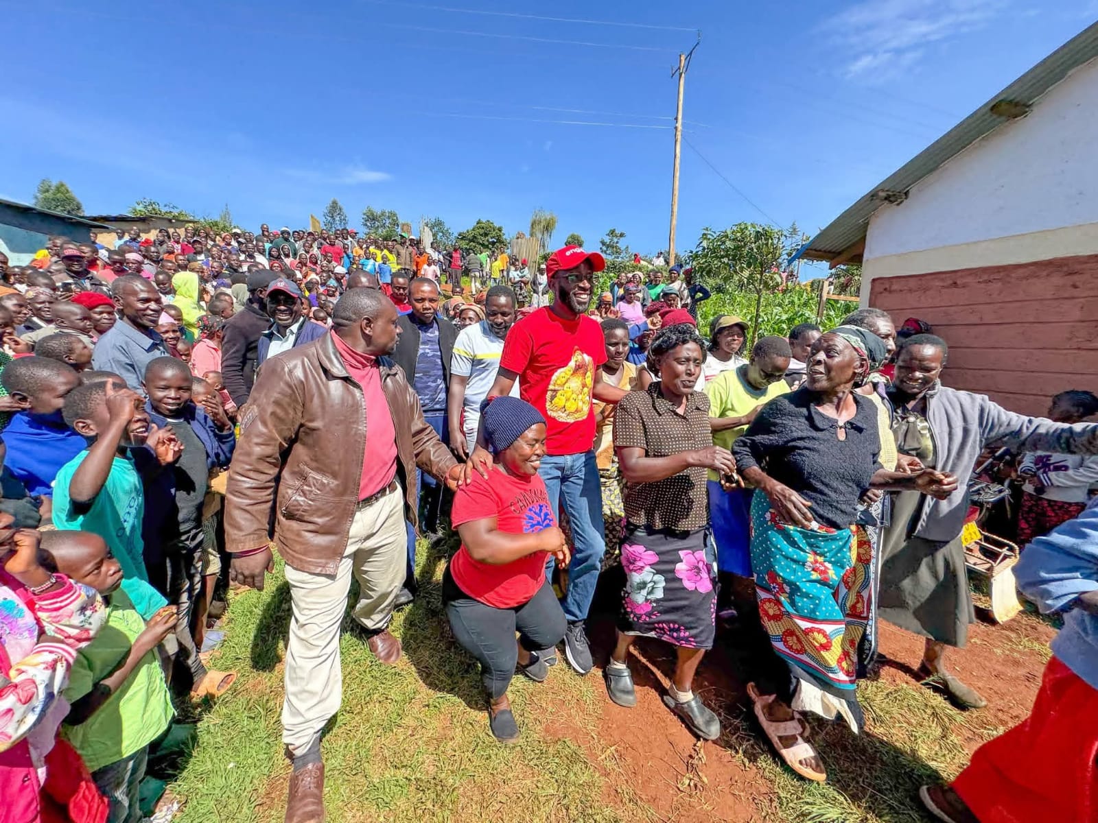 Kitutu Masaba MP Clive Gisairo(Centre in red) with Parents staff and pupils of Kenyerere Primary School during the commissioning of new modern Classrooms built by NG-CDF. Photo/Enock Okong'o