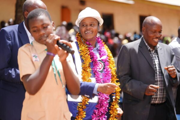 Bomachoge Borabu MP Obadiah Barongo in light moments with the stafff and Girl guide leader during the ground breaking ceremony for Kemoreko Comprehensive School. Photo/Enock Okong'o.