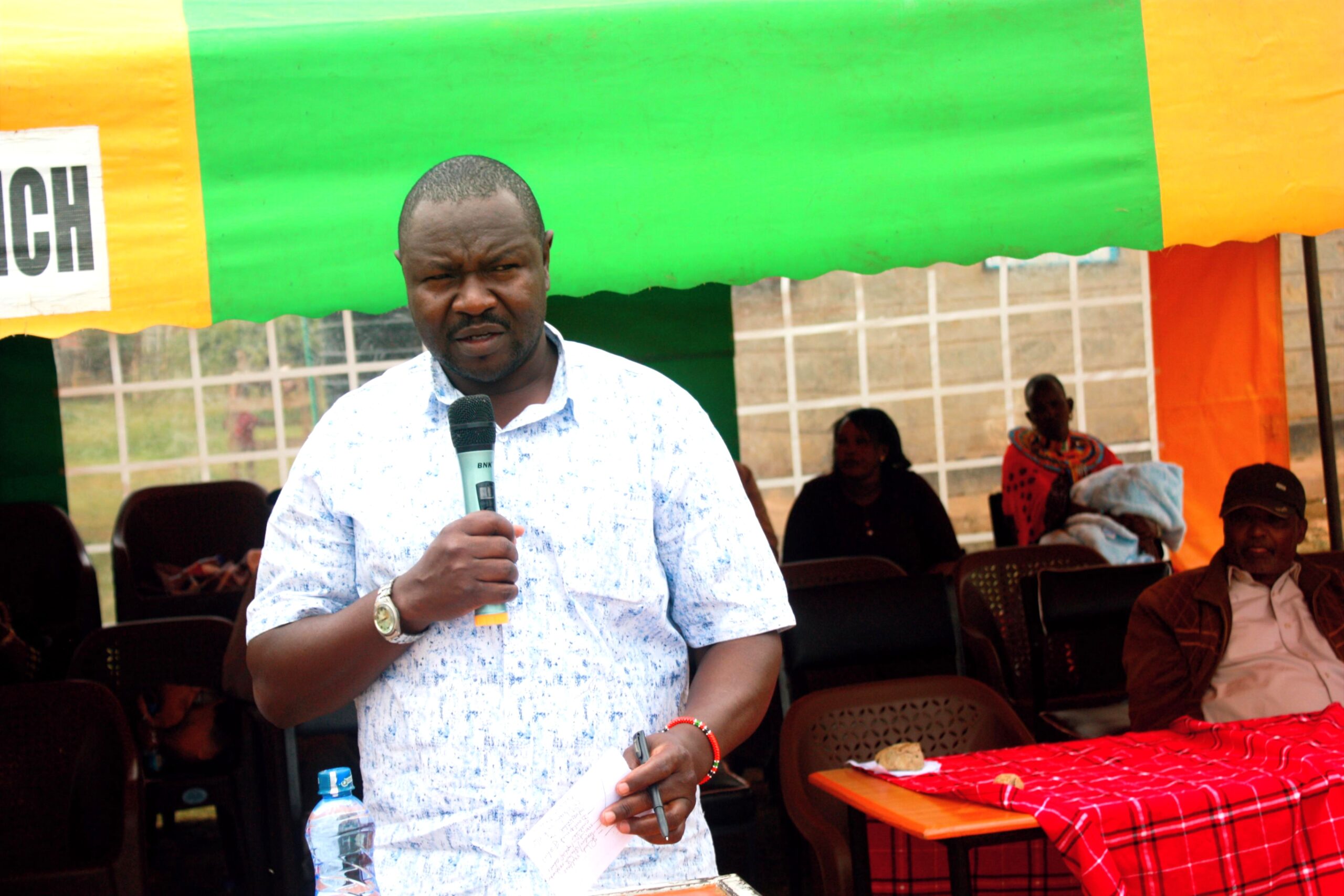 Samburu County Director of Education Abraham Kenei addressing parents at Kisima Girls Senior School in Samburu County during school AGM