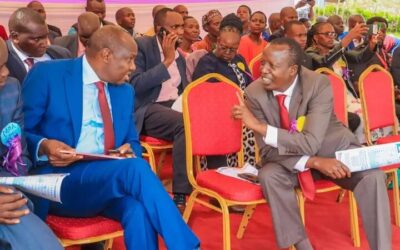 Head of Public Service Felix Koskei (l) with Tinderet MP Julius Melly during Cheboron School event