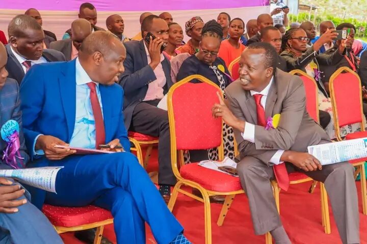 Head of Public Service Felix Koskei (l) with Tinderet MP Julius Melly during Cheboron School event