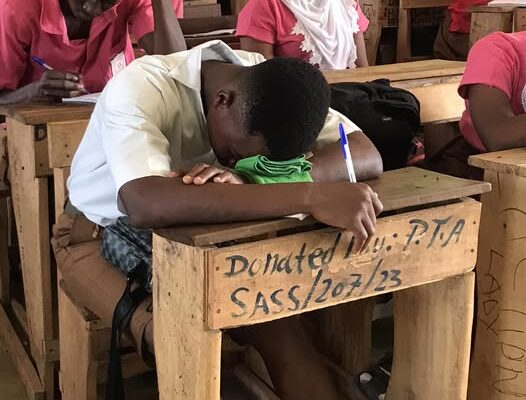 A learner sleeping in class