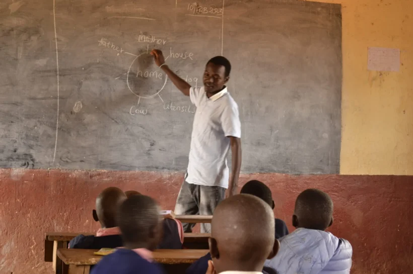 A young teacher in class during teaching practice