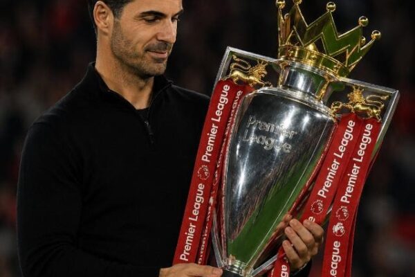 Arsenal manager Mikel Arteta holding the English Premier League trophy