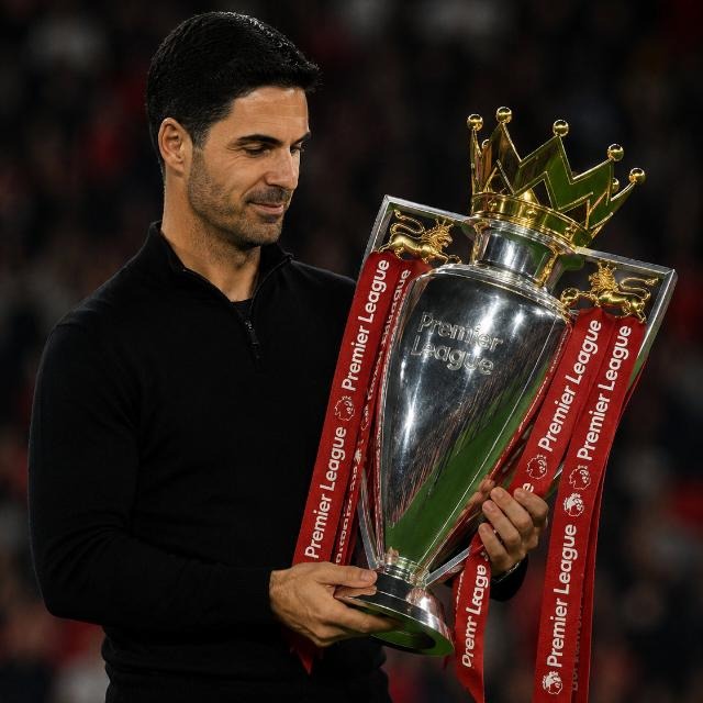 Arsenal manager Mikel Arteta holding the English Premier League trophy