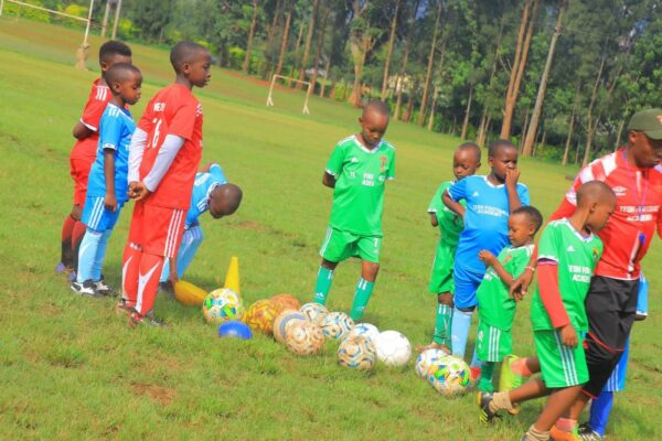 Tesh Football Academy members with their coach at Kisii school. Photo: Enock Okong'o.